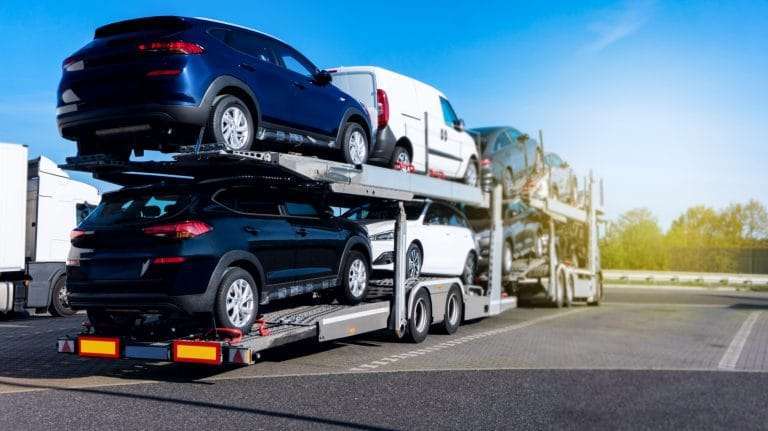 Open trailer auto transportation of new cars